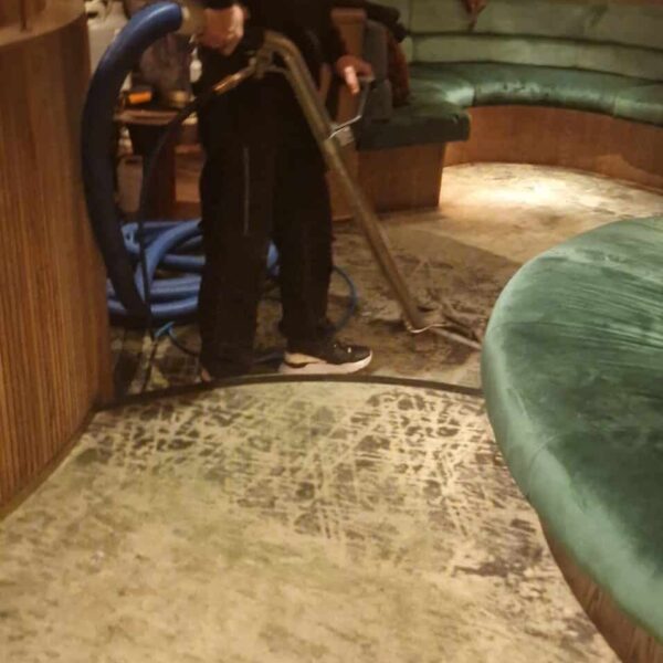 Out-of-hours restaurant carpet cleaning London at Amazónico Mayfair, showing a Prestige technician performing deep steam restoration.