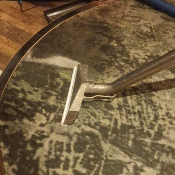 Professional restaurant carpet cleaning London at Amazonico, Mayfair, showing a steam cleaning wand extracting deep-seated dirt from luxury hospitality carpets.