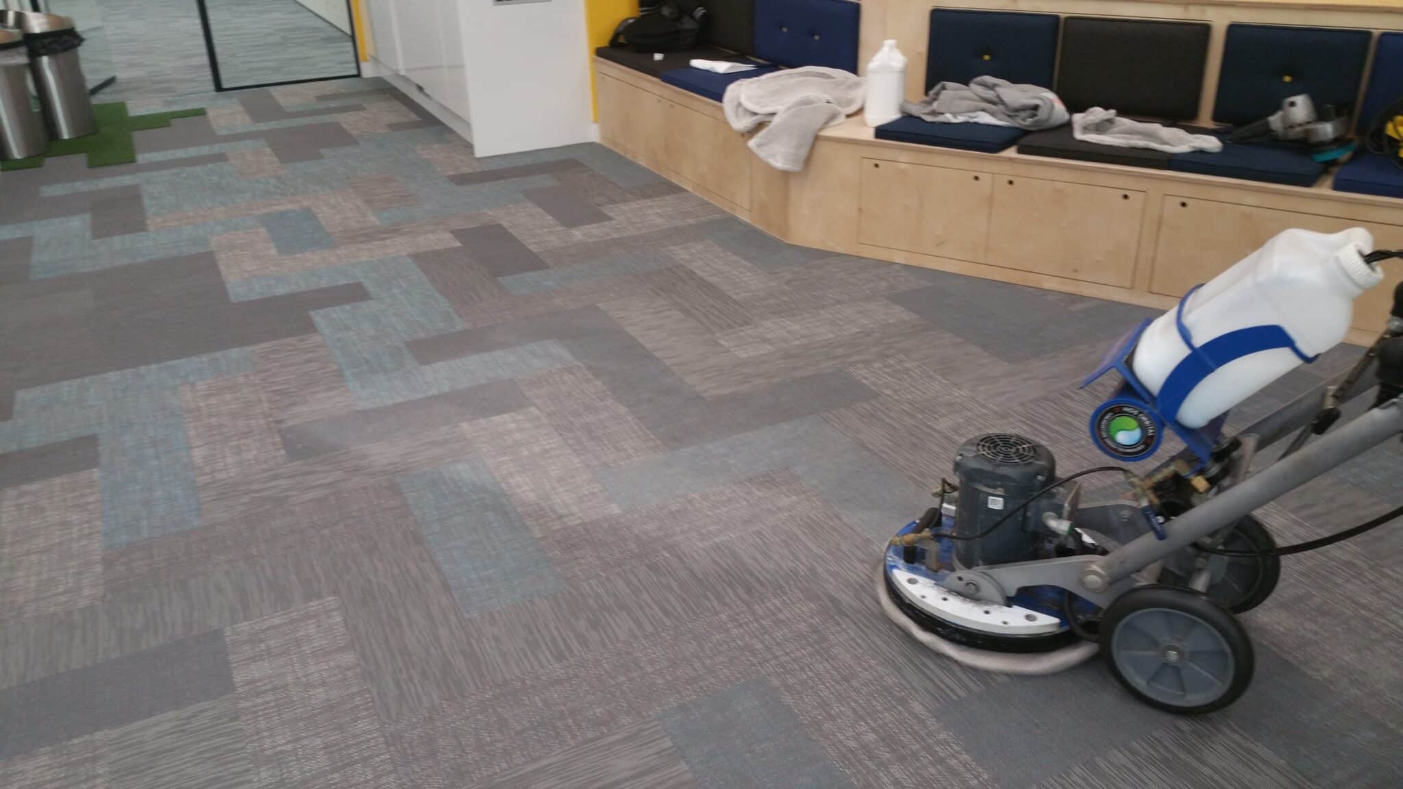 Prestige Commercial team utilising the HOS Orbot system for specialist Bolon floor cleaning in a Central London office.